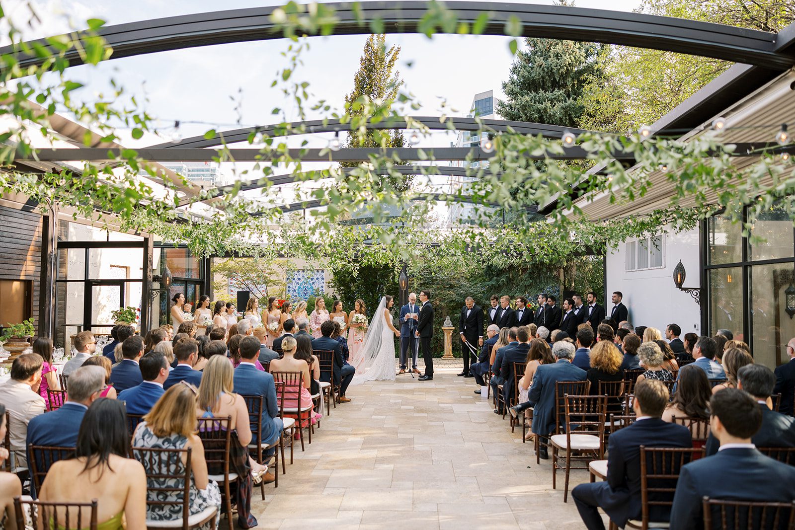 Bride and groom say their vows during their Galleria Marchetti wedding ceremony