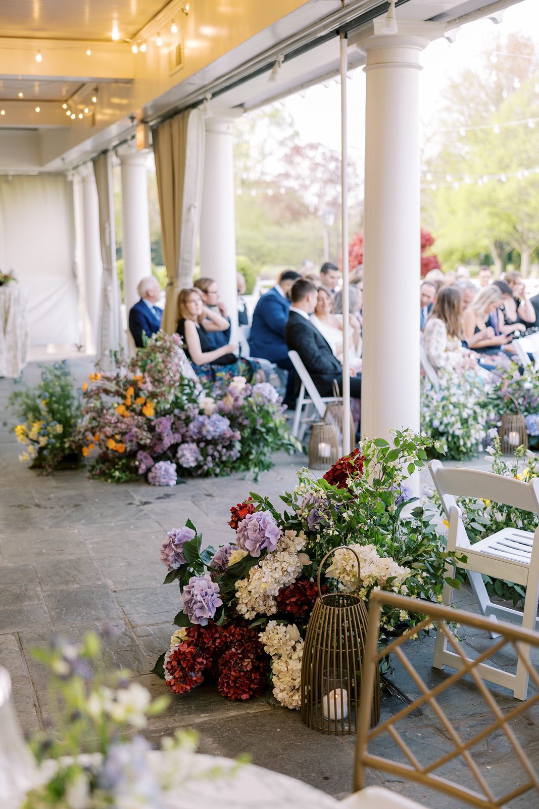 Guests seated outdoors for the Saddle & Cycle Club wedding