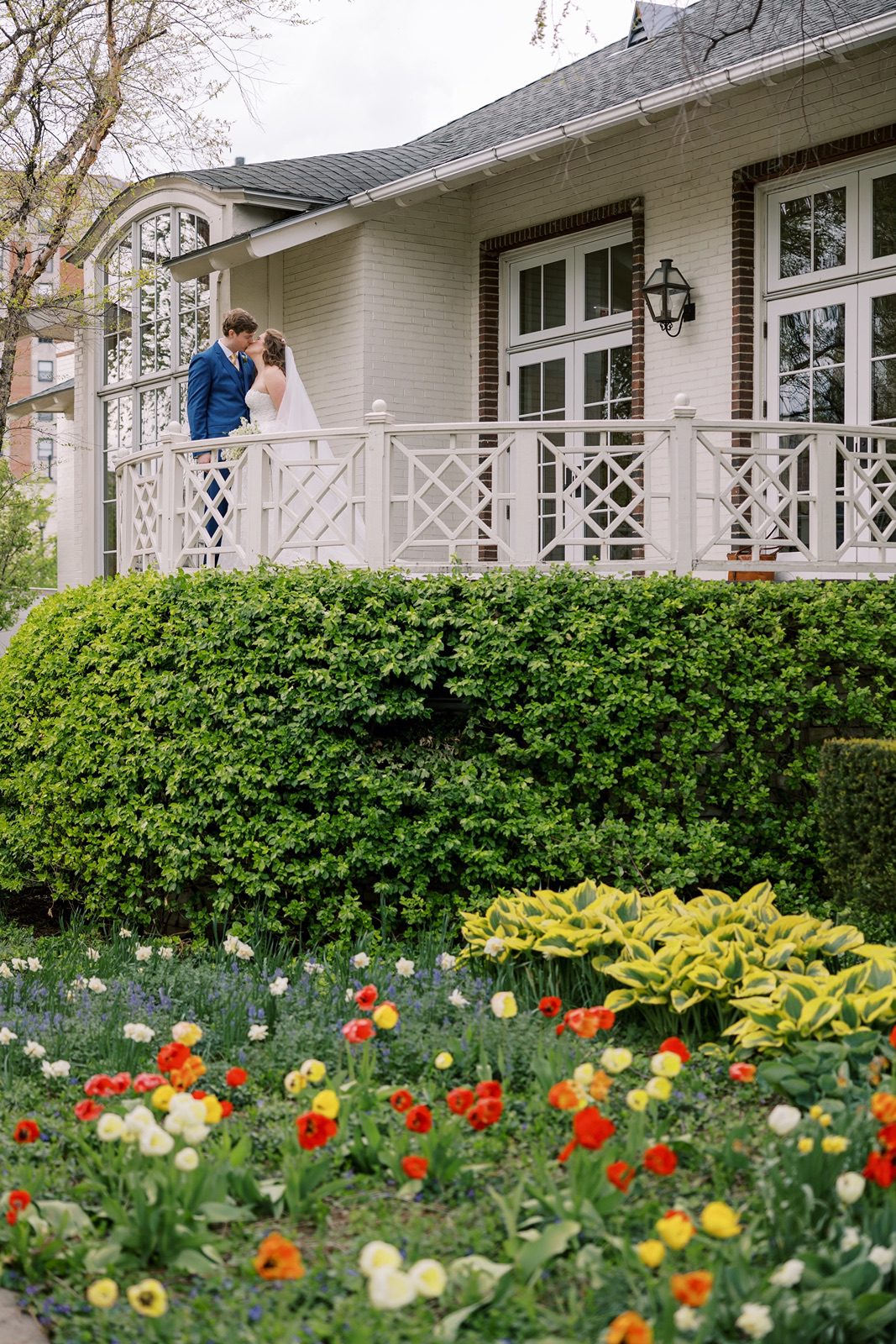 Bride and groom kiss at their Saddle & Cycle Club wedding