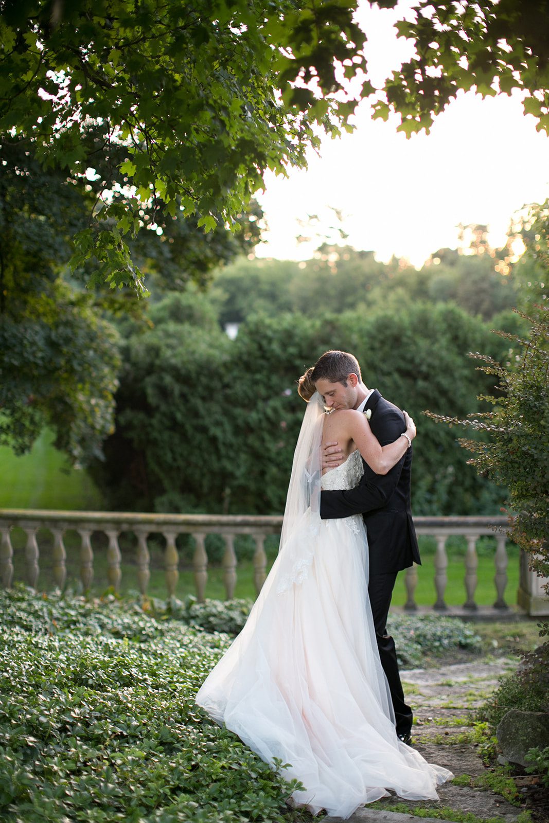 Bride and groom hug at their Cuneo Mansion wedding